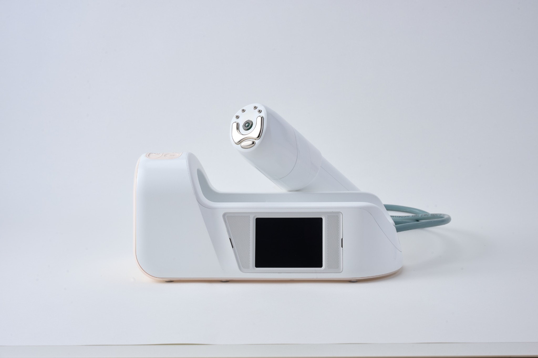 Front view of the AET-Shot station with the treatment head raised from its dock